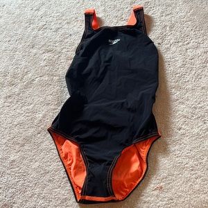 Girls size 28 speedo LZR pro tech suit. Black with orange straps.